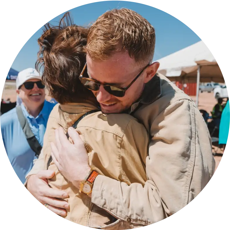 George hugging client